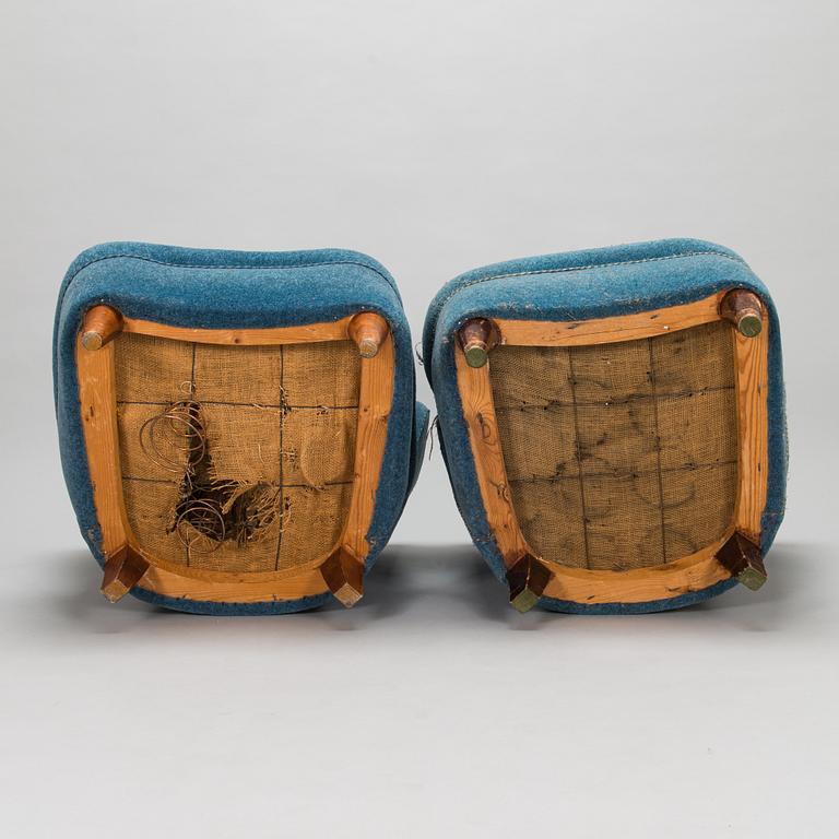A pair of mid-20th-century armchairs.