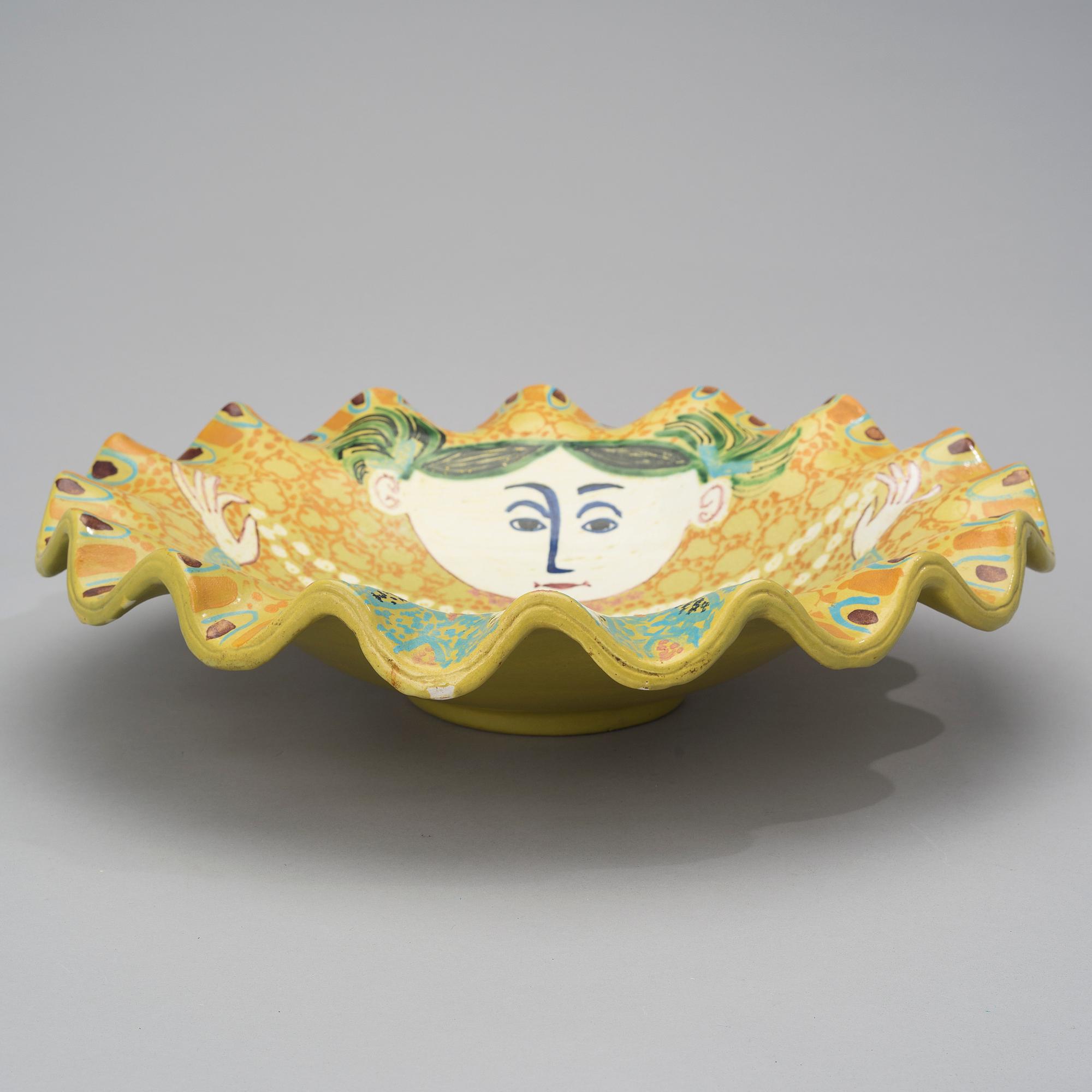BIRGER KAIPIAINEN, A CERAMIC DISH. The girl with the pearl necklace. Signed Kaipiainen. Arabia, 1940s.