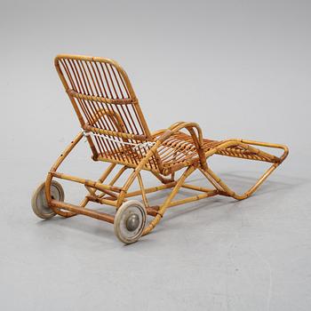 A rattan lounge chair.