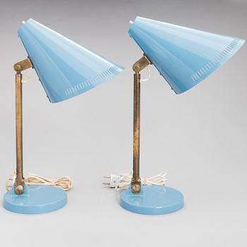 A pair of desk lamps by Paavo Tynell manufactured by Taito Oy.