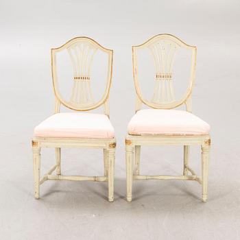 A öpair of painted Gustavian chairs.
