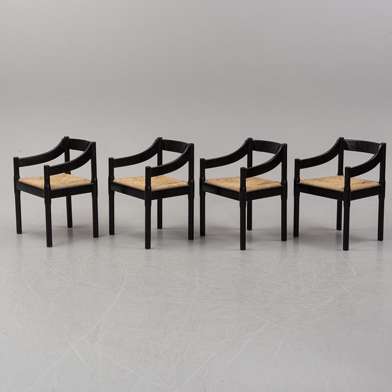 Vico Magestretti. Four black lacquered chairs with rope seats, "Carimate". Cassina, Italy.