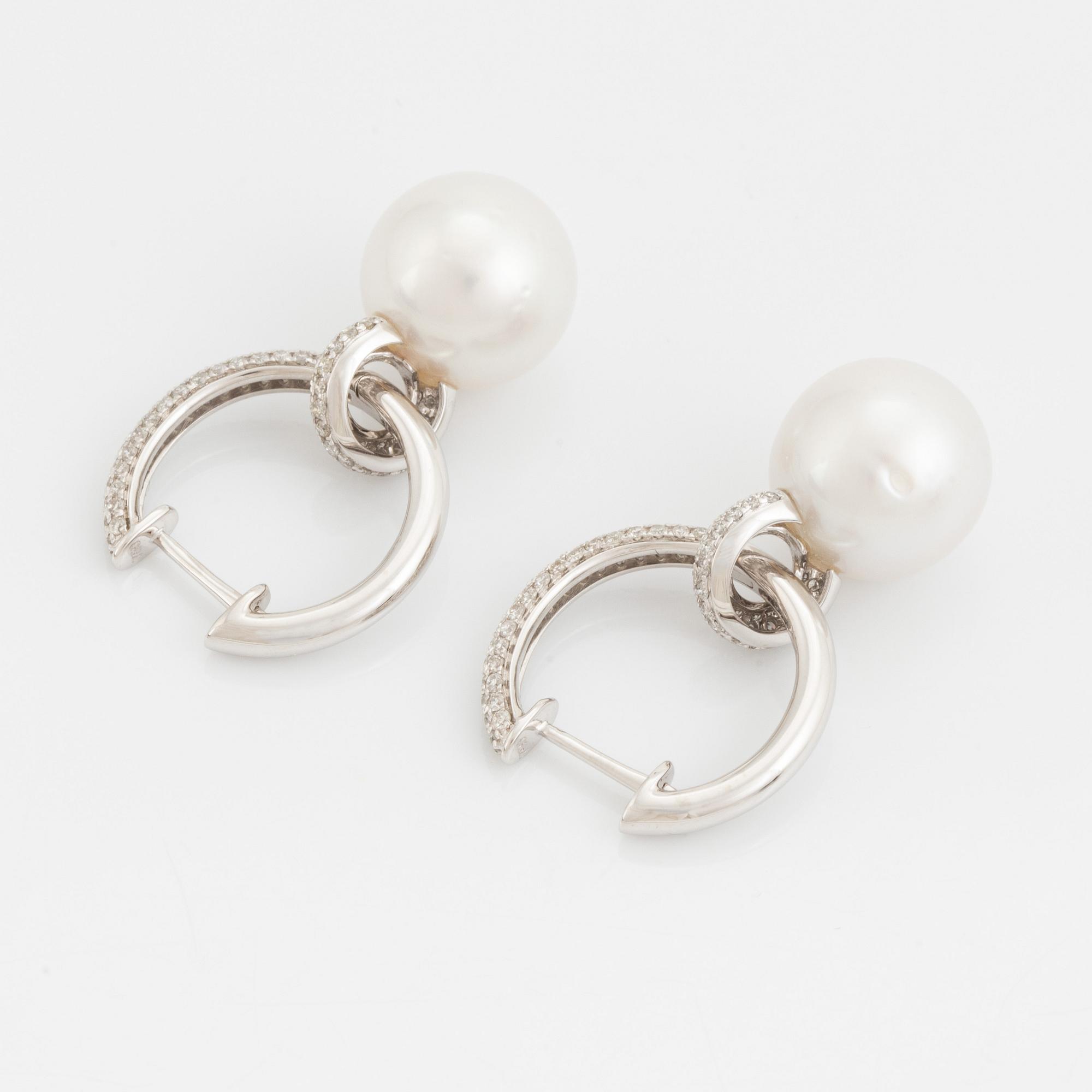 Pearl and brilliant cut diamond earrings.