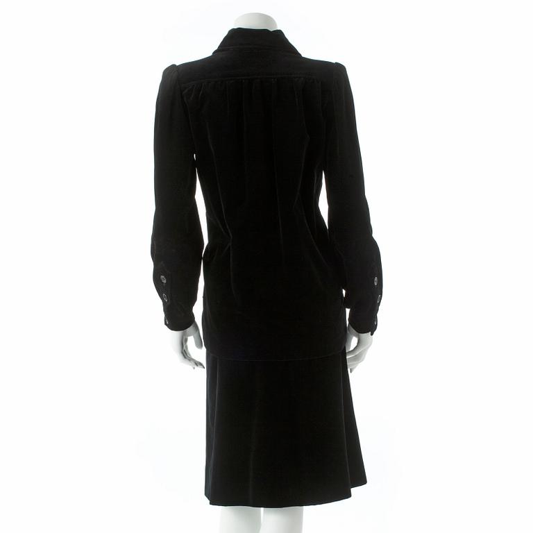 YVES SAINT LAURENT, a two-piece black velvet dress consisting of jacket and skirt, from the Russian collection.