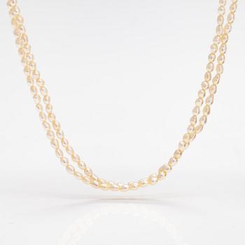 A two-strand pearl collier with cultured pearls and 14K gold clasp.