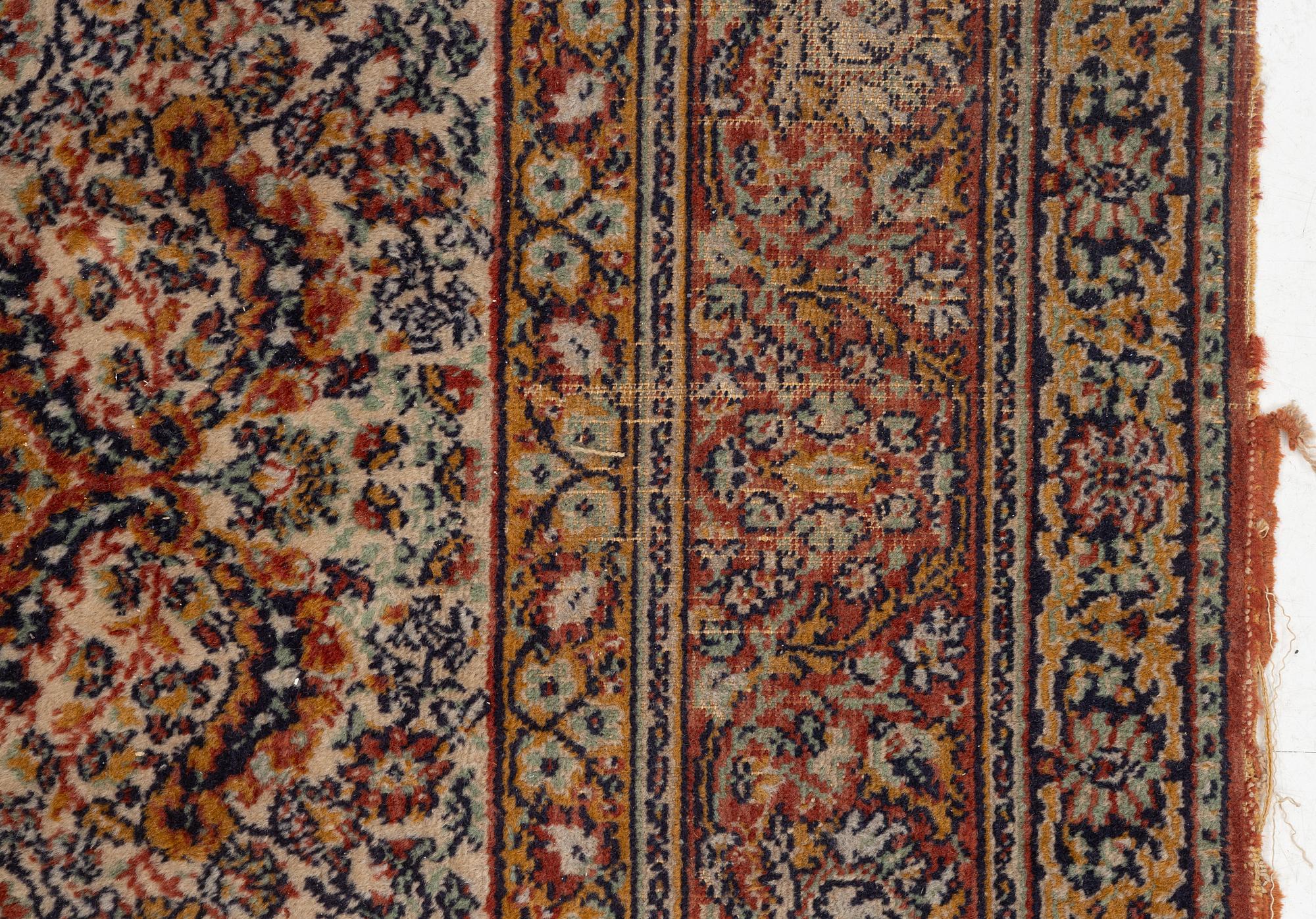 A semi-antique oriental carpet, c. 290 x 195 cm.