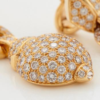 Cartier a pair of earrings in 18K gold set with round brilliant-cut diamonds.