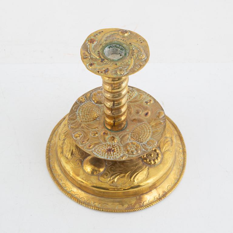 A Swedish repousse-brass baroque candlestick, circa 1700.