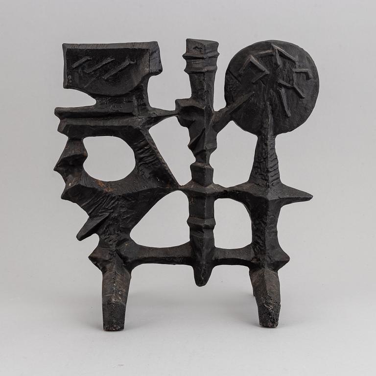 OLLE HERMANSSON, a cast iron sculpture, marked Husqvarna.