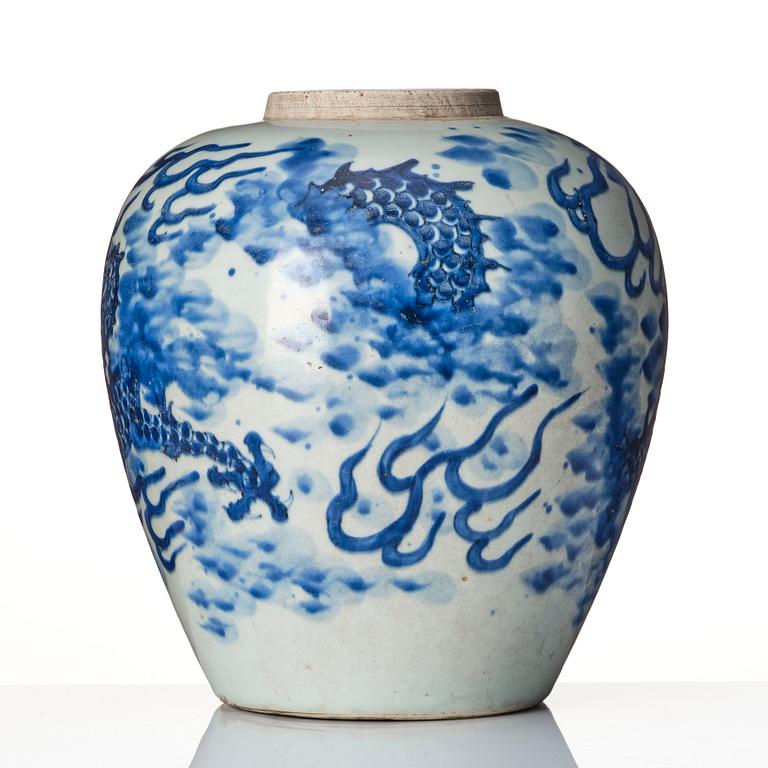 A blue and white Transitional jar with a four clawed dragon, 17th Century.