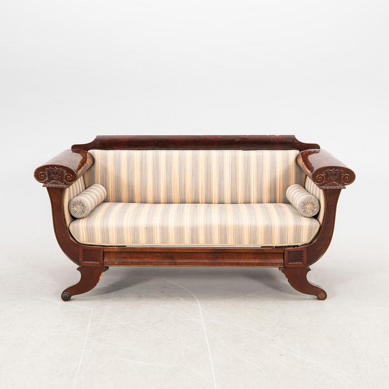 A mid 1800s late Empire mahogany sofa.