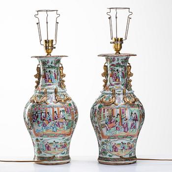 A pair of famille rose Canton vases made in to lamps, Qing dynasty, 19th Century.