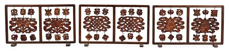 A set of three partly lacquered and gilded wooden screens, Qing dynasty (1644-1912).