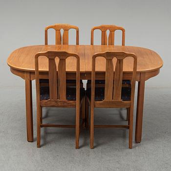 A five-piece walnut 'Ambassadör' dining suite by Carl Malmsten.