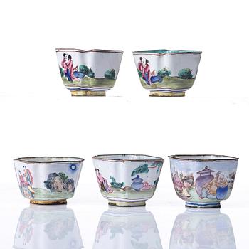 A set of five enamel on copper tea cups and a dish, Qing dynasty, circa 1800.