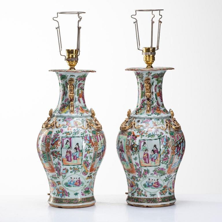 A pair of famille rose Canton vases made in to lamps, Qing dynasty, 19th Century.