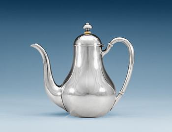 1277. A RUSSIAN PARCEL-GILT TEA-POT, makers mark of Nichols & Plinke, St. Petersburg 1869.