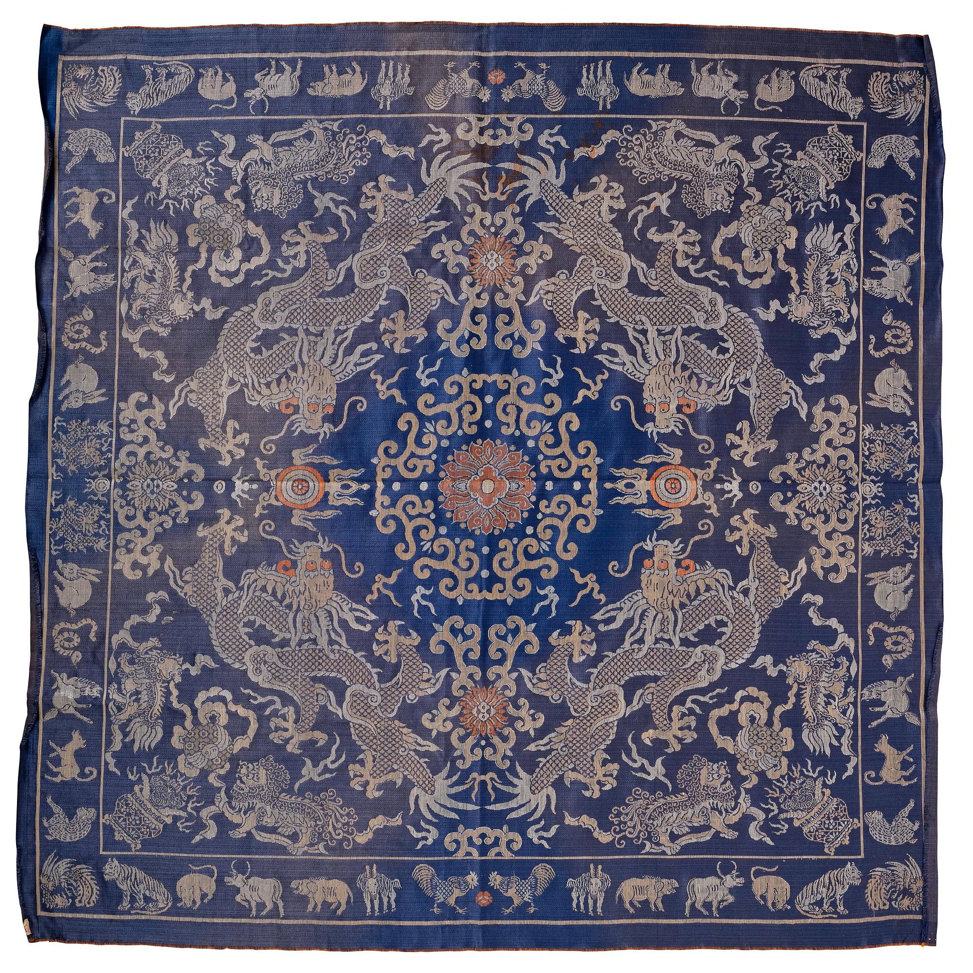 A silk blue-ground brocade panel, late Qing dynasty/early 20th century.