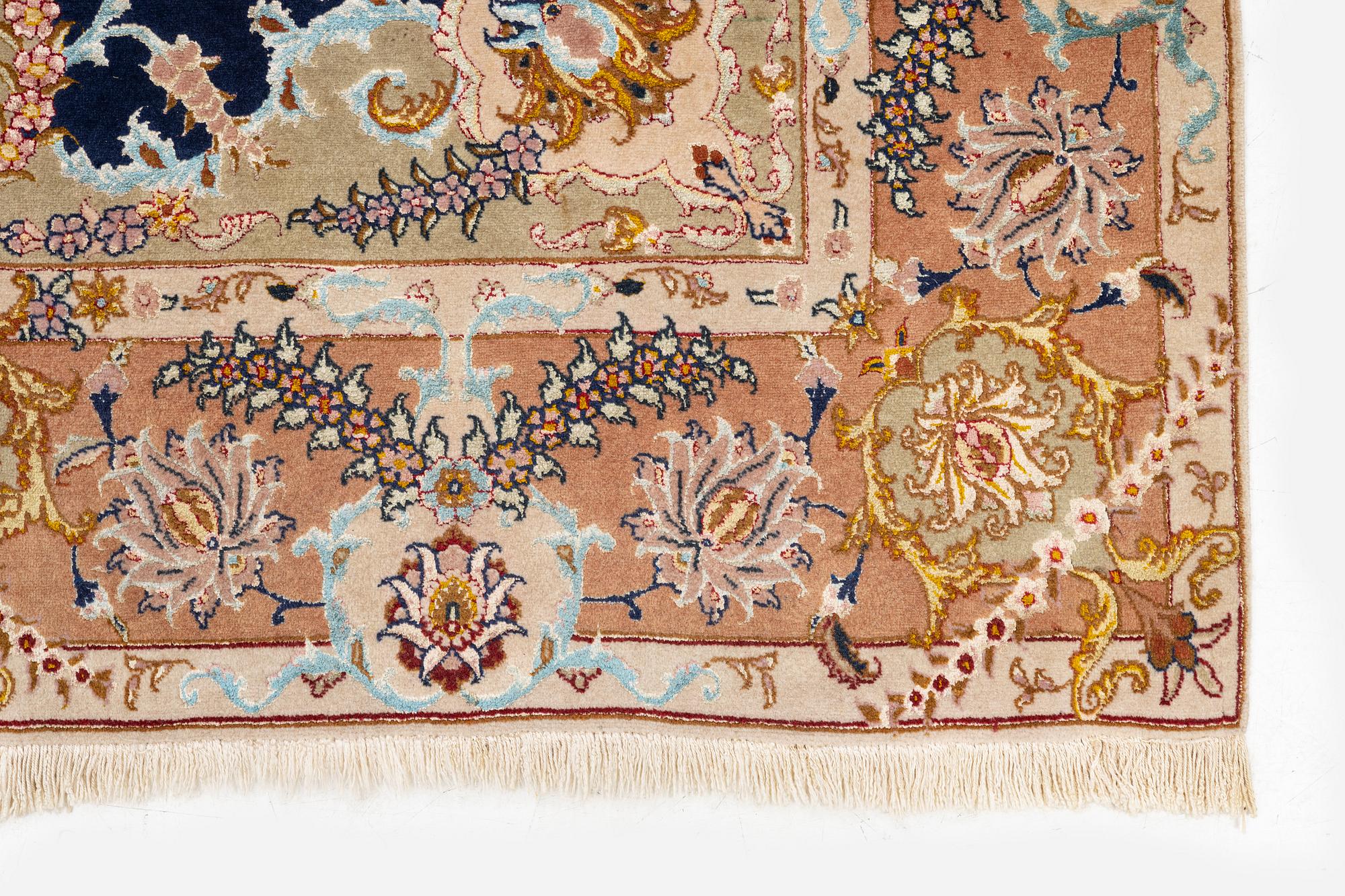 A Tabriz carpet, part silk, c. 206 x 147 cm.