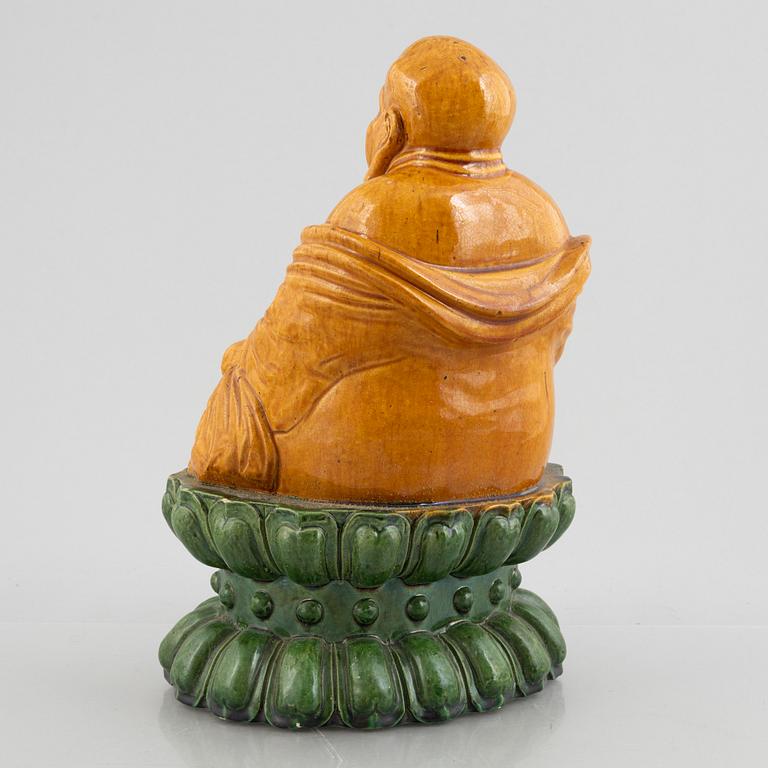 A ceramic Budai, China, 20th century.