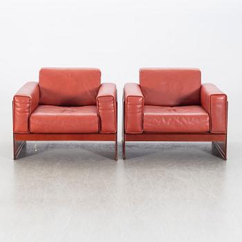 A pair of armchairs by Tito Agnioli for Matteo Grassi, second hal of the 20th century.