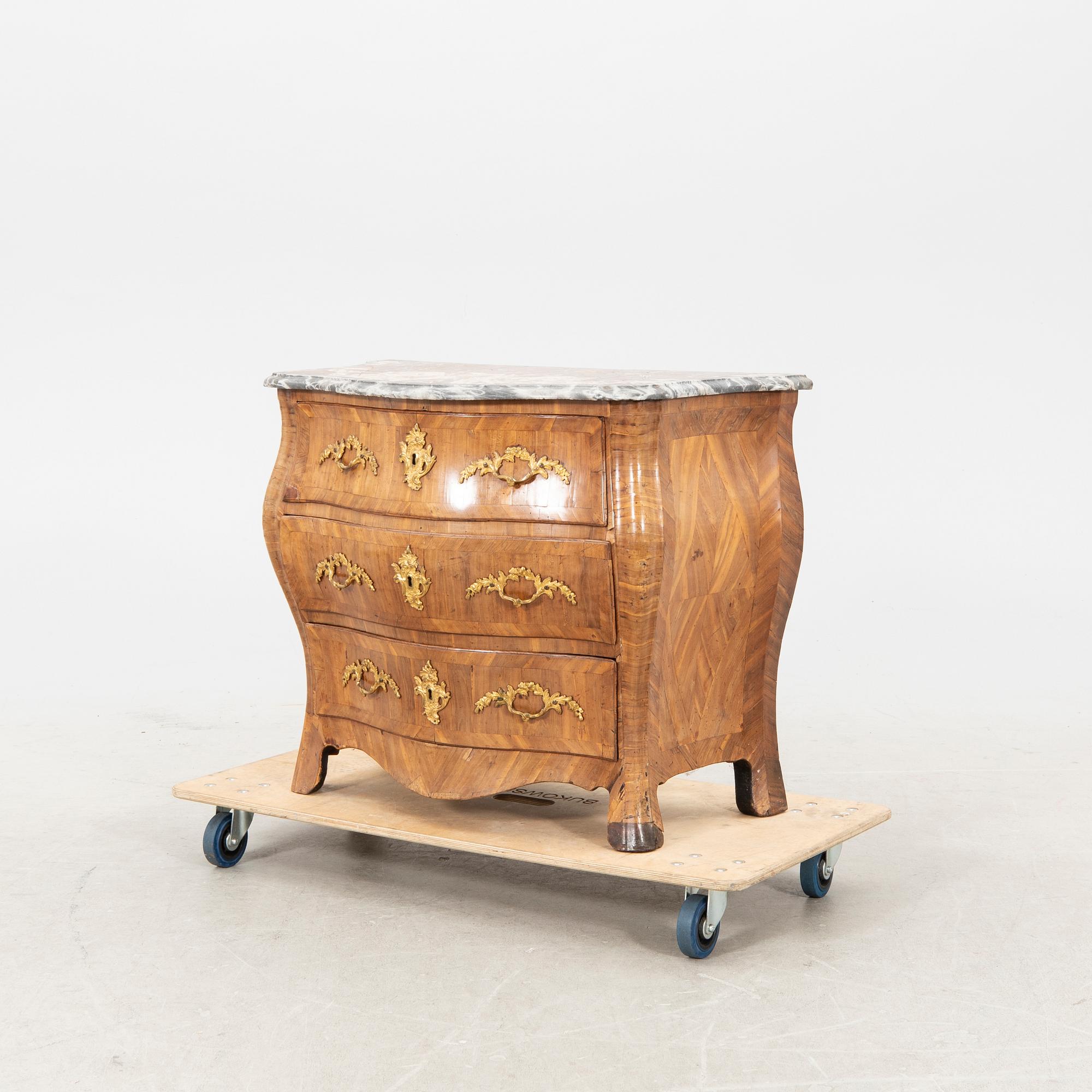 A mid 1700s Rococo dresser.