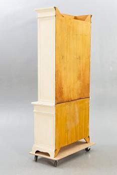 A modern painted display cabinet.