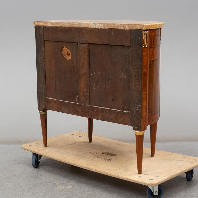 A Louis XVI-style 20th century commode.