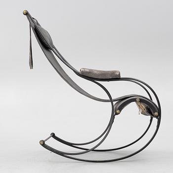 An iron rocking chair, R.W Winfeild & Company, England, late 19th century.