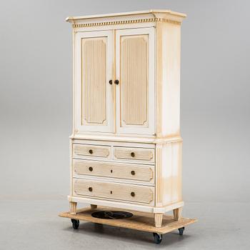 A gustavian style cabinet, circa 1900.