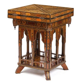 357. A Syrian ebonised, marquetry and mother-of-pearl inlaid games table. Circa 1900.