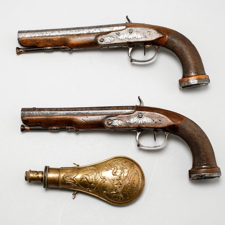 A pair of percussion guns, around the mid 19th century.