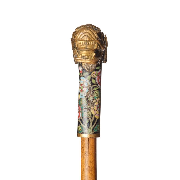 A Chinese bamboo walking cane with a cloisonné handle, late Qing dynasty/early 20th Century.