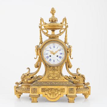 A Louis XVI-style gilt bronze mantel clock, 19th Century.