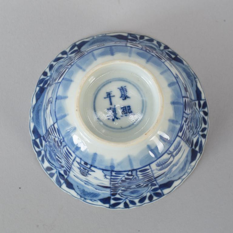 Six Chinese blue and white cups with dishes, early 20th century.