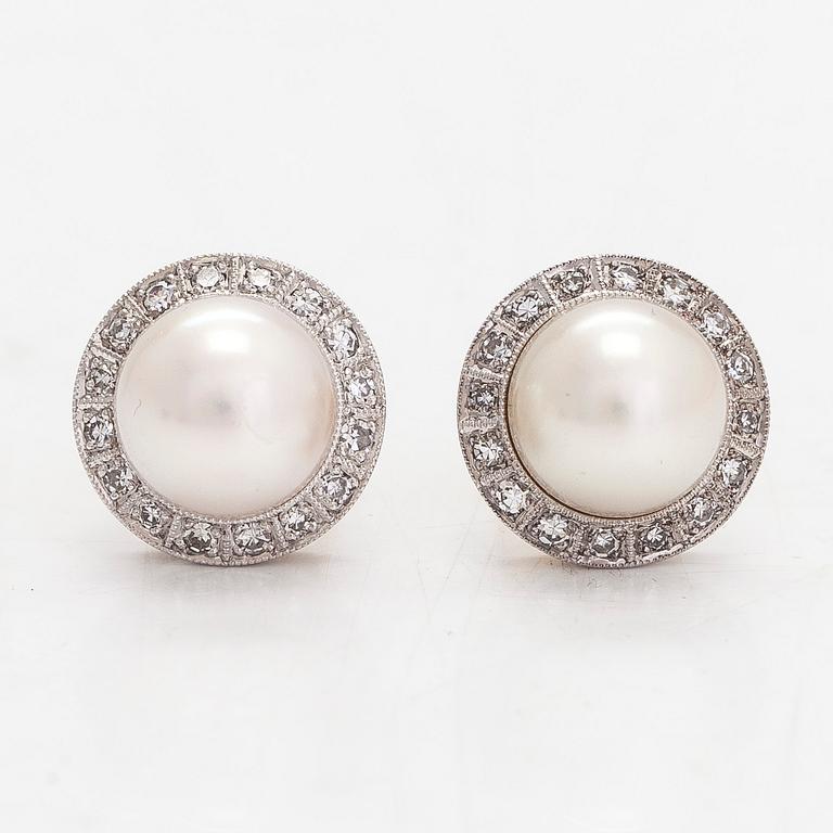 Torbjörn Tillander, a pair of 18K whitegold earrings with cultured pearls and diamonds approx 0.21 ct in total.