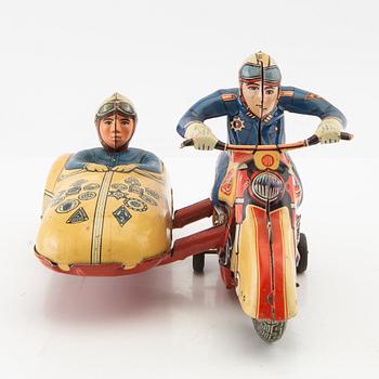 Toy motorcycle with sidecar. Huki Germany mid-20th century lithographed tin.