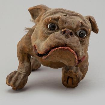 A circa 1900 papier maché toy dog.