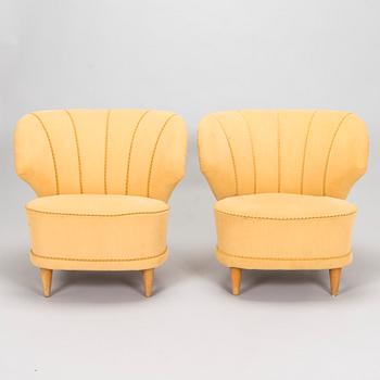 A pair of mid-20th century armchairs.