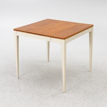 A dining table, mid-20th century.