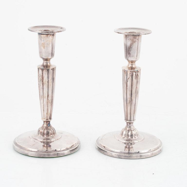 A group of four silver candlesticks, including GAB Eskilstuna, Sweden, 1976.