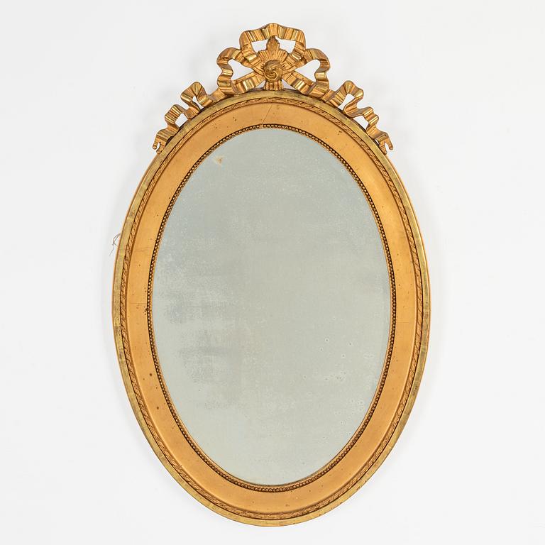 An oval Gustavian style mirror, early 20th Century.