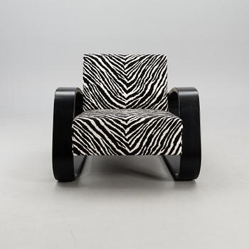 An armchair no 400, designed in 1936.