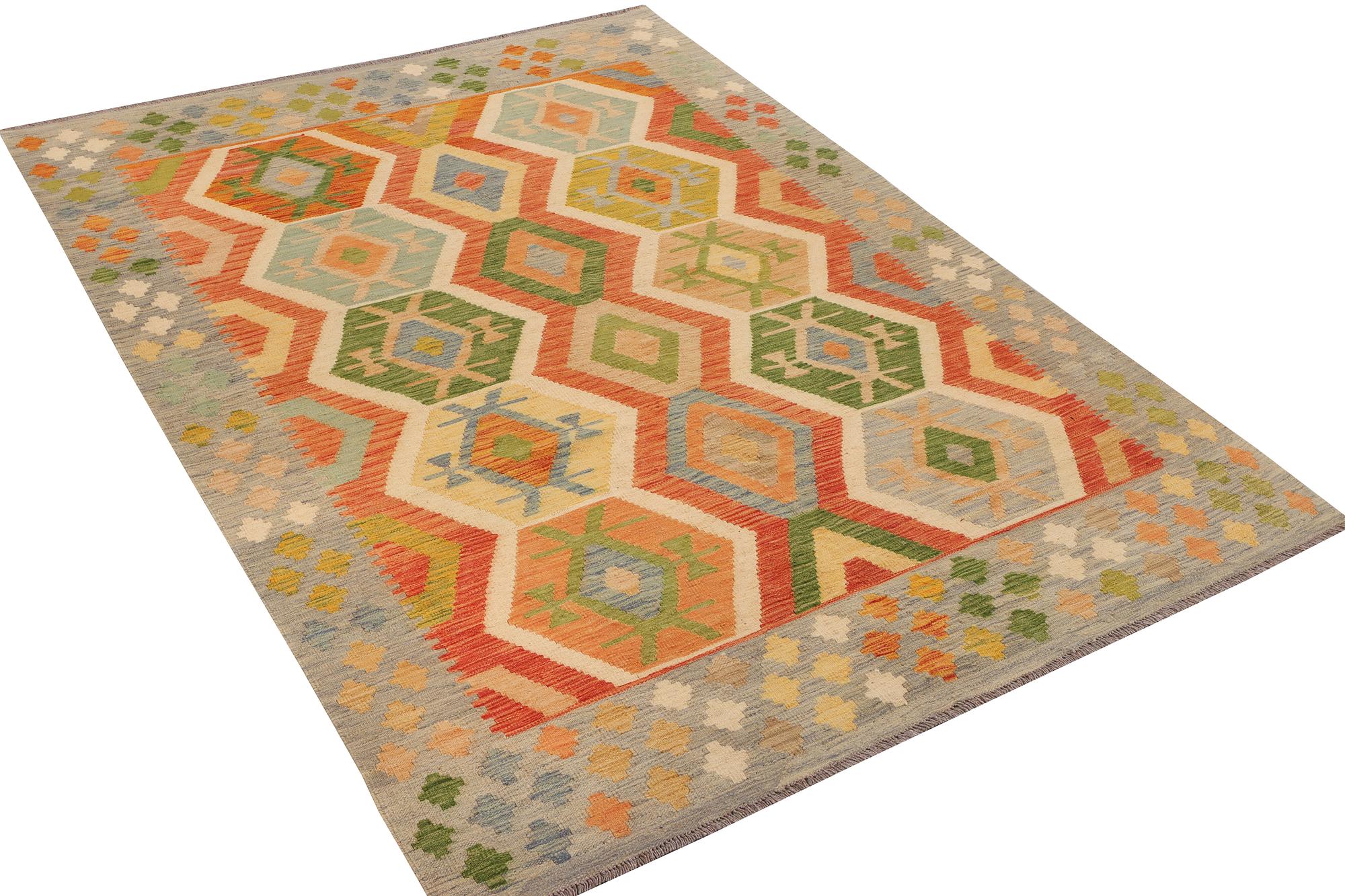 An Afghan kelim carpet, c. 237 x 169 cm.