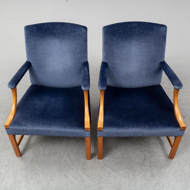 A mid 20th Century pair of oak armchairs attributed to Carl Malmsten.
