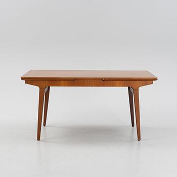 A 1960s teak veneer dining table.