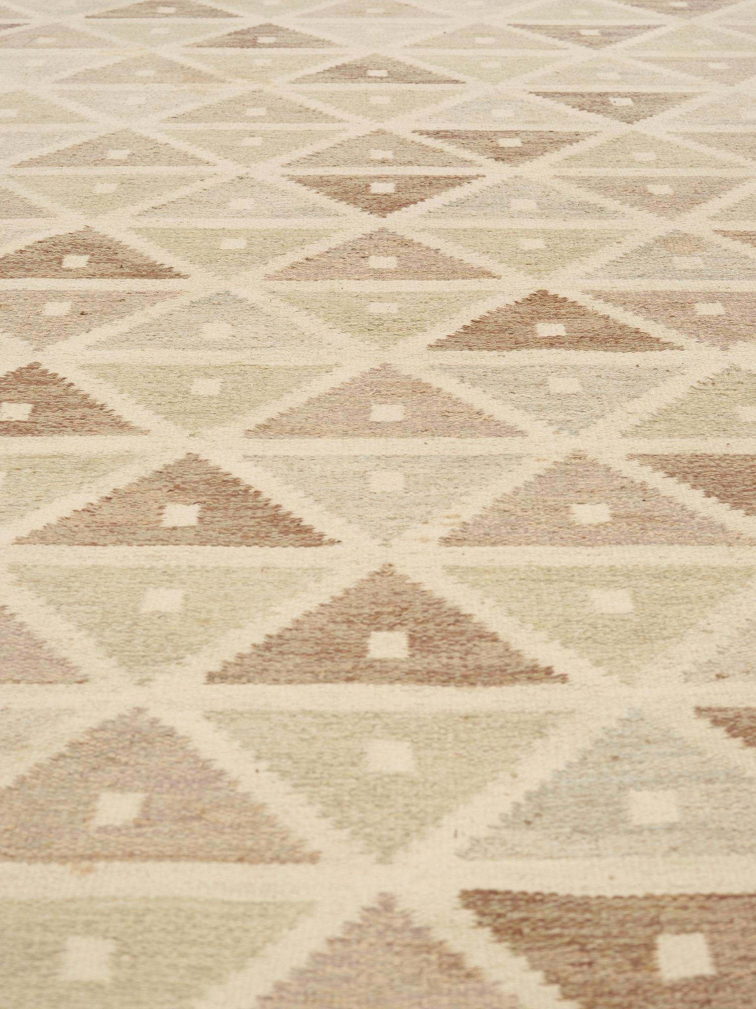A CARPET, "Harlequin", flat weave, 382 x 318 cm, signed SB (Sigvard Bernadotte).