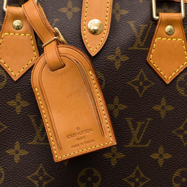 LOUIS VUITTON, a 'Housse Porte-Habits' garment bag.