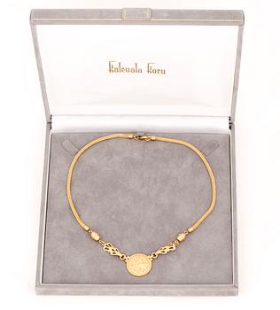 KAULAKORU, "Aurinkoleijona", 18K kultaa. Kalevala Koru 1998.