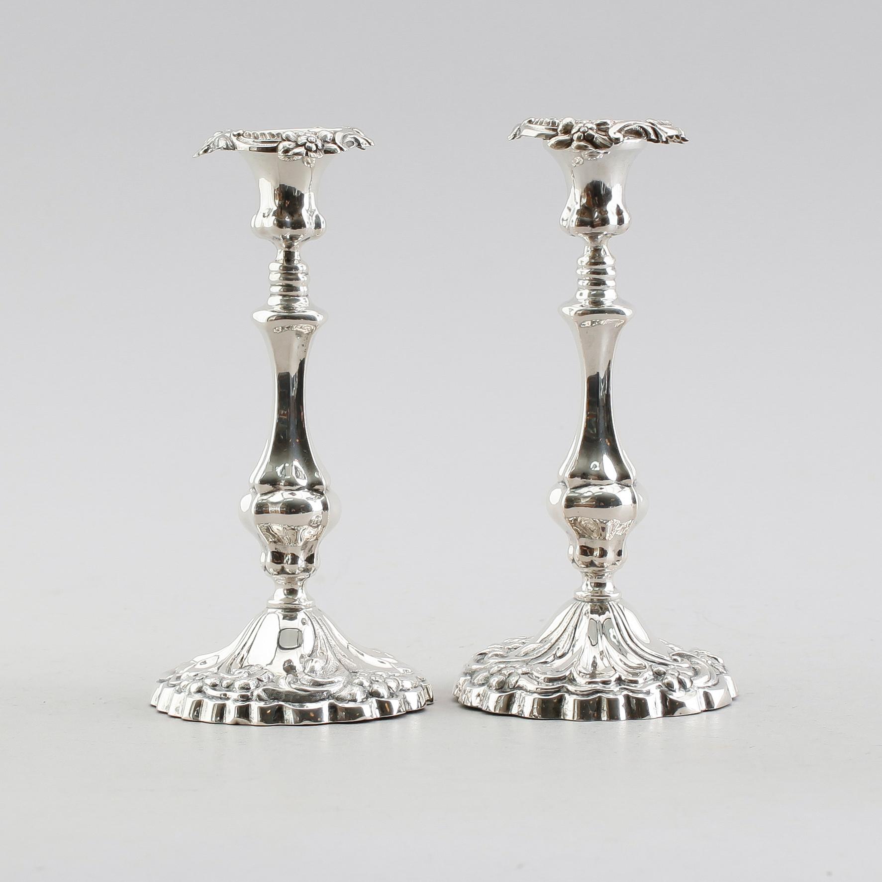 LJUSSTAKAR, ett par, silver, 1861.